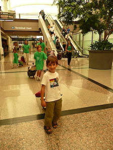 Homeward bound! my 6-year-old son pulls the luggage through the Denver airport after BlogHer 2010.