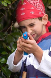 What to do about the parent-child personality clashes? Photo of a boy dressed like a pirate playing with a toy gun. Photo credit: Jennifer Margulis.