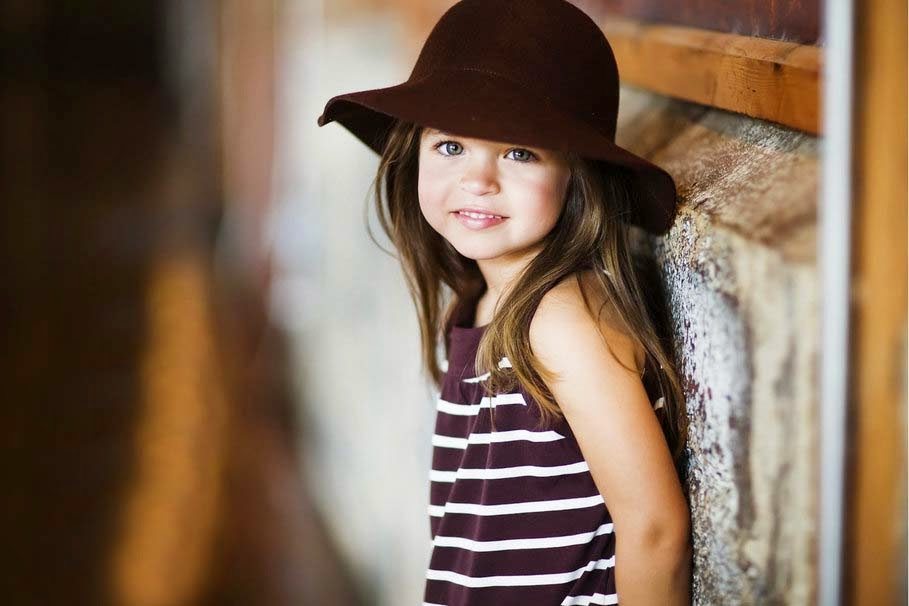 Make two lifestyle changes and never use antibiotics again. Via Jennifer Margulis, Ph.D. Photo of a girl with brown hair wearing a brown hat and brown and white striped shirt.