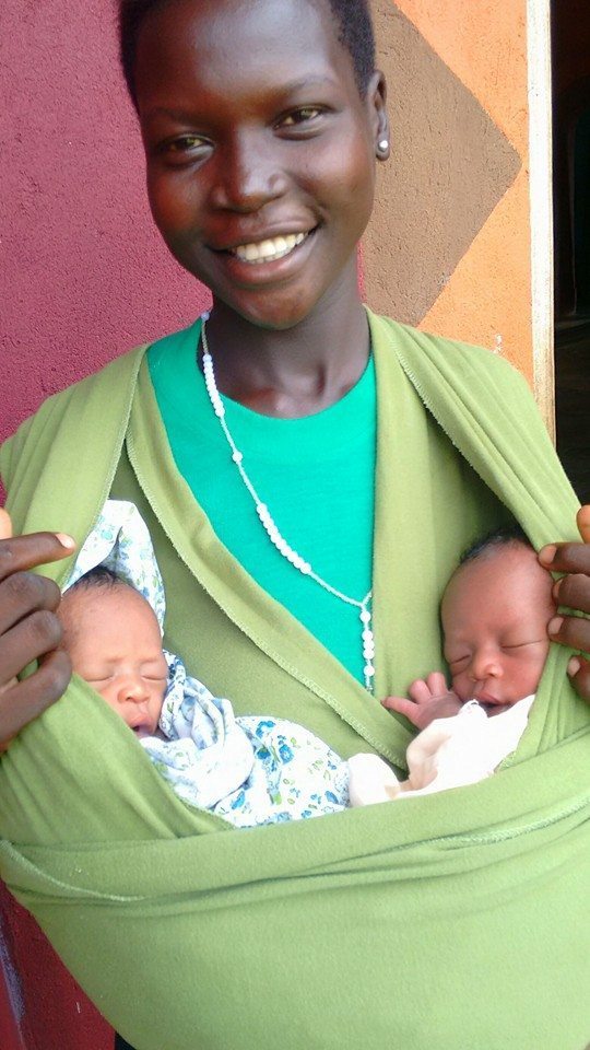 A mom in Uganda holding her newborn twins. Photo courtesy of Rachel Zaslow