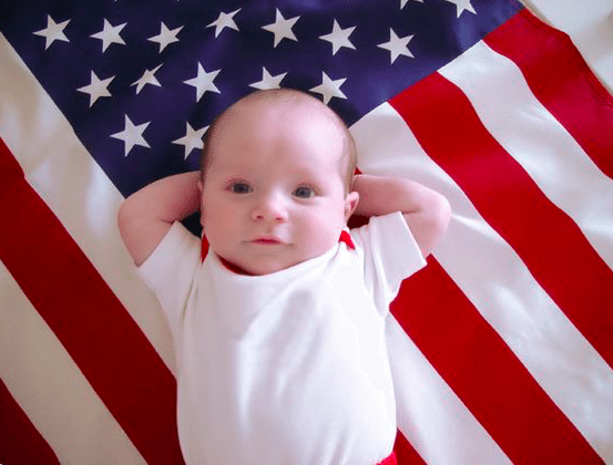 California's law barring kids from school are un-American and un-Constitutional. Photo of a baby on an American flag via picture-baby dot com | Jennifer Margulis