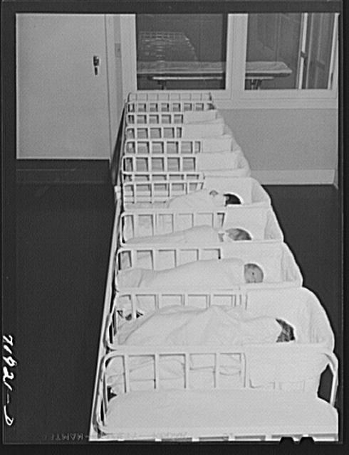 Newborns swaddled and sleeping alone in the nursery at the Cairns General Hospital Eleven Mile Corner, Arizona. Is it safe for babies to be alone? Photo via Library of Congress