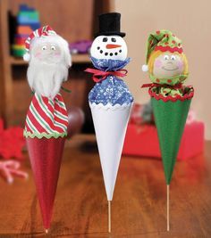 A Santa pop-up puppet, a snowman, and an elf
