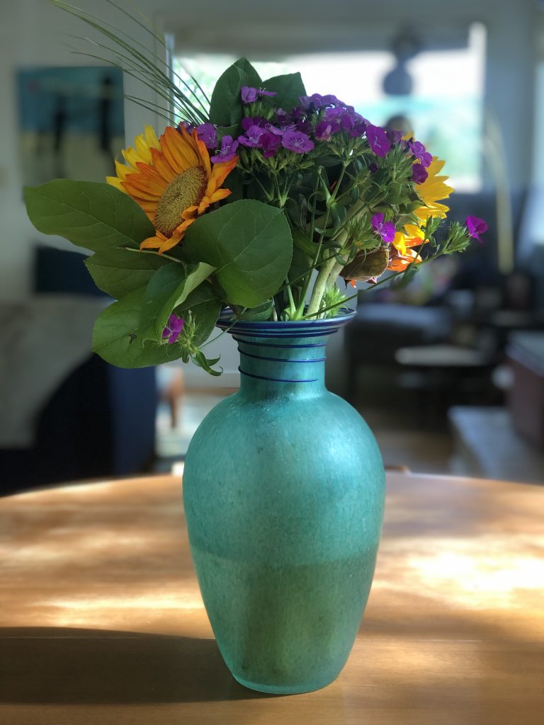 Tamiflu alternatives: better, safer remedies via JenniferMargulis.net photo of a bouquet of flowers in a blue vase