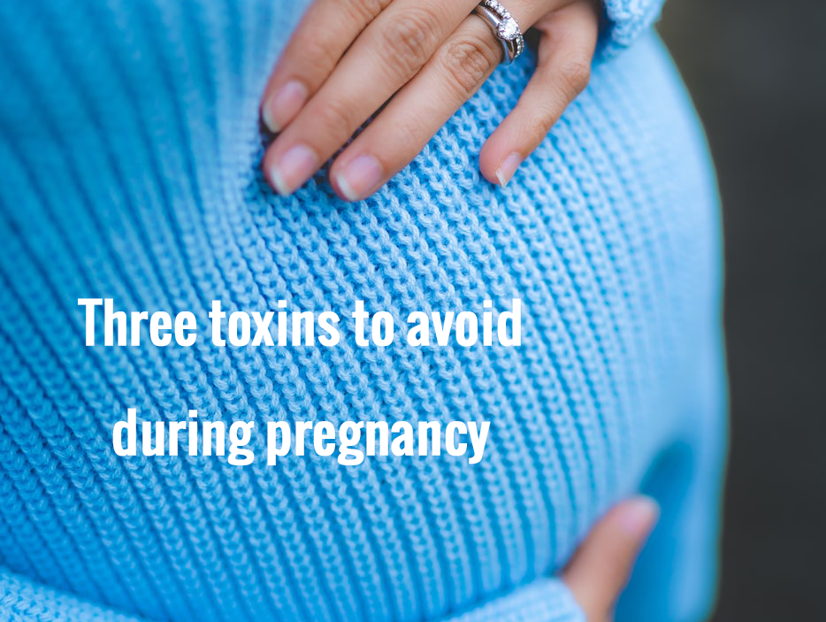 Three toxins to avoid during pregnancy and three things to embrace. Photo of a pregnant woman wearing a blue knit sweater courtesy of Juan Encalada. | Jennifer Margulis, Ph.D. 