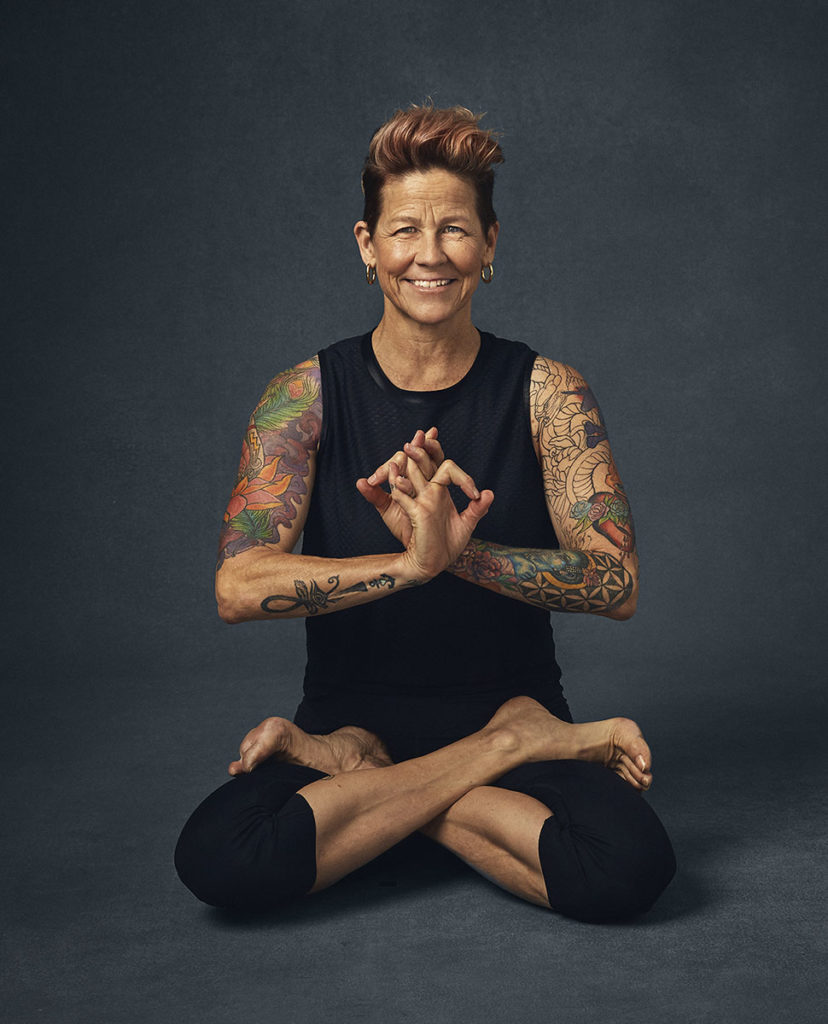 A picture of feminine strength. Dana Trixie Flynn is a yogi who says "vulnerability is really letting people see your heart--that's the most beautiful strength." Photo by Sophy Holland. Courtesy of Gallery Books.