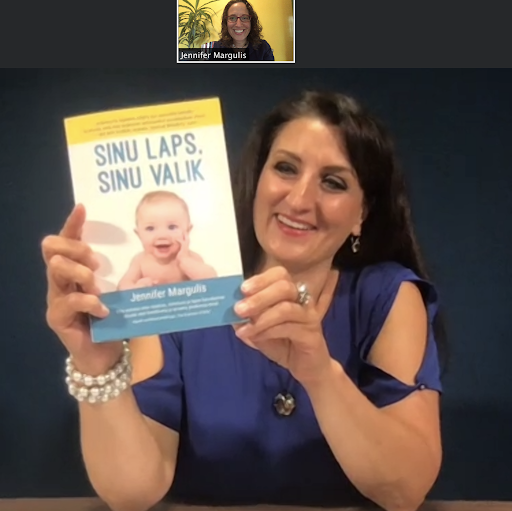 Carmen Pritson holding "Your Baby, Your Way" in Estonian on a zoom call.